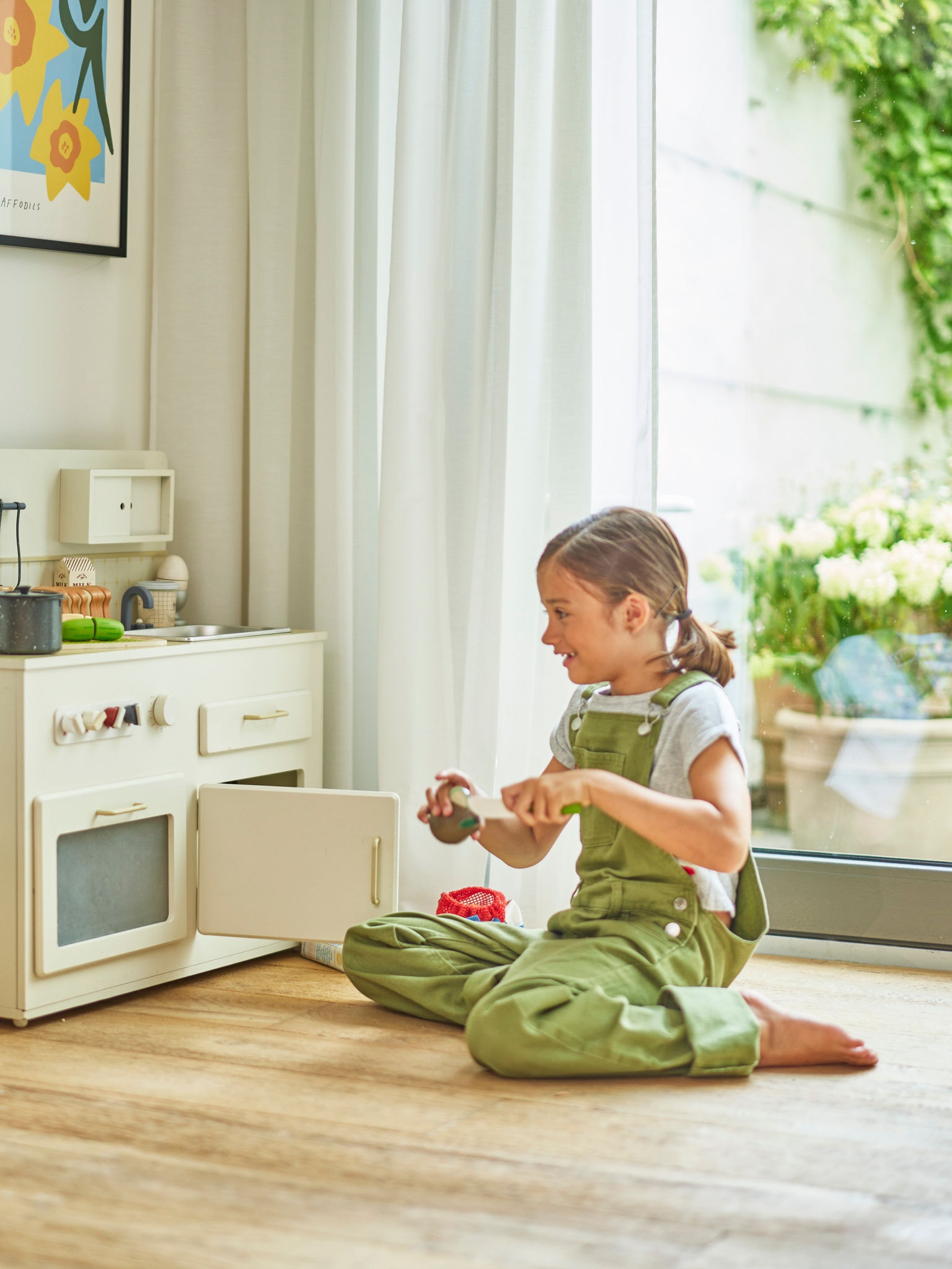 Child playing on the floor in a comfortably heated home with correctly sized heat pump system
