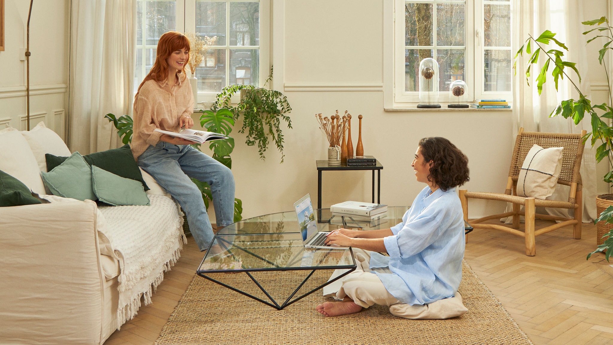 Two women sitting in their living room