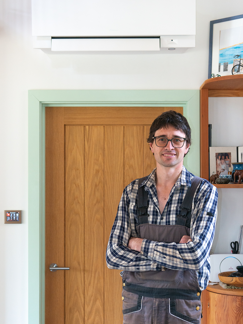 Homeowner Tom in-front of indoor unit