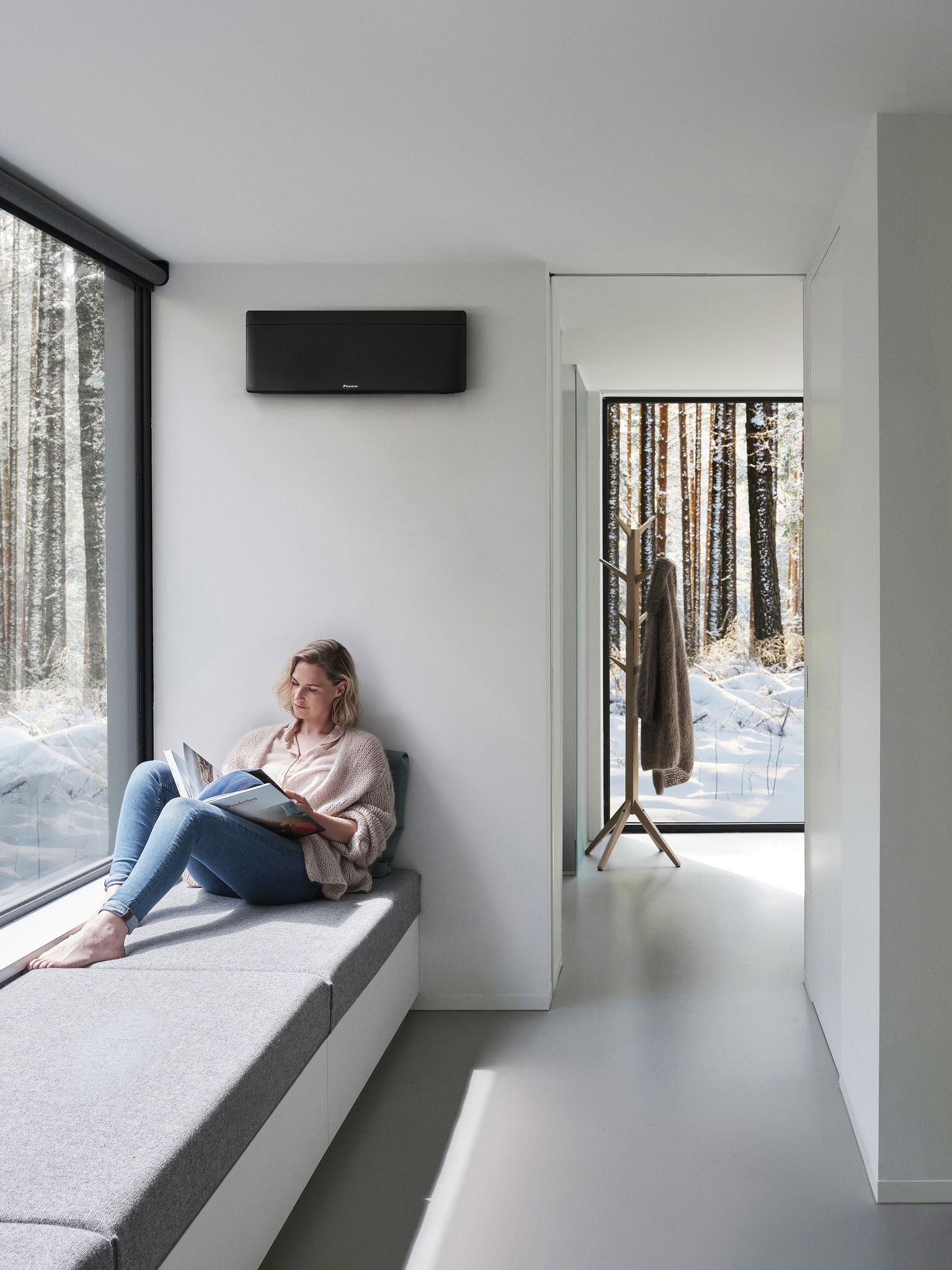 Woman siting by window