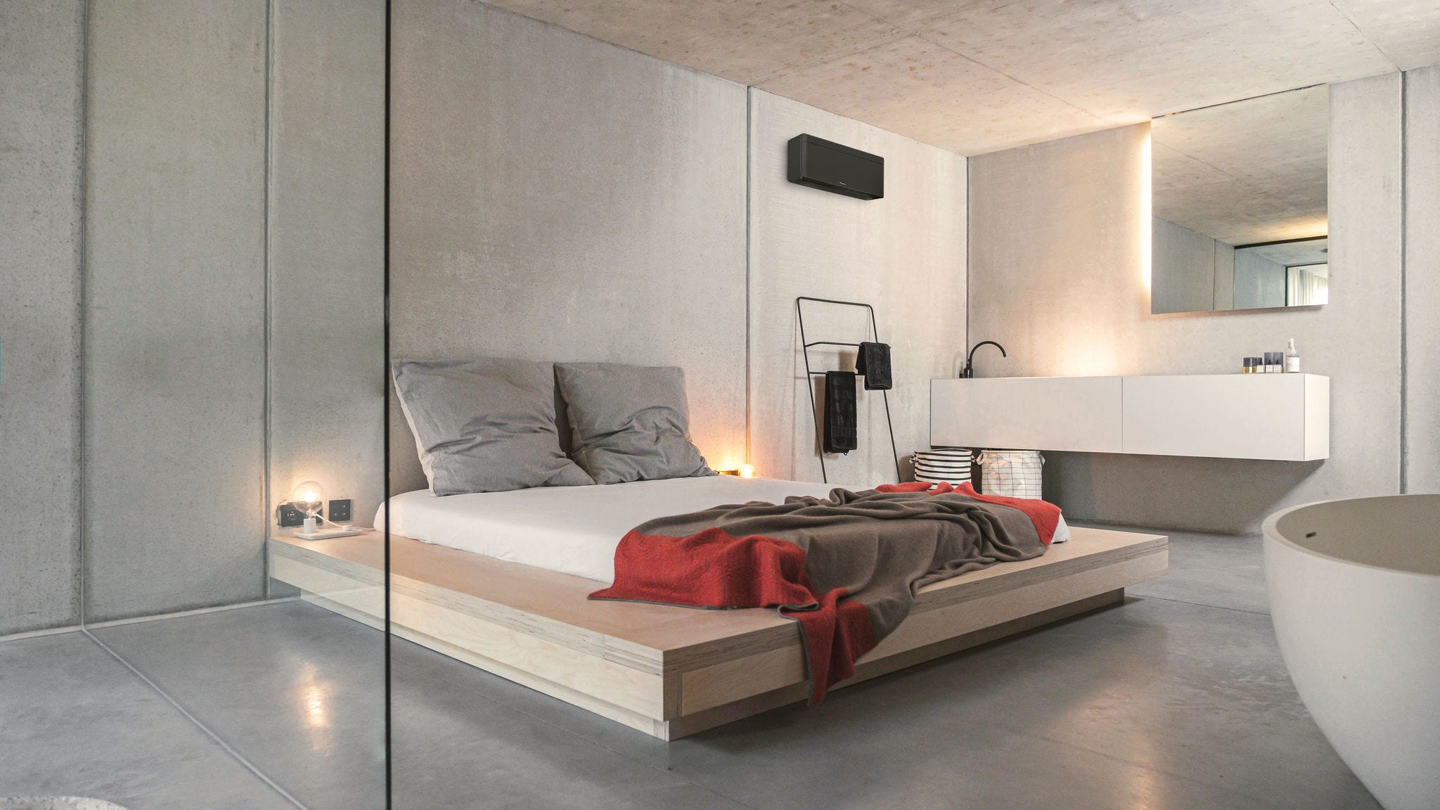 Installer putting an air-to-air heat pump on the wall