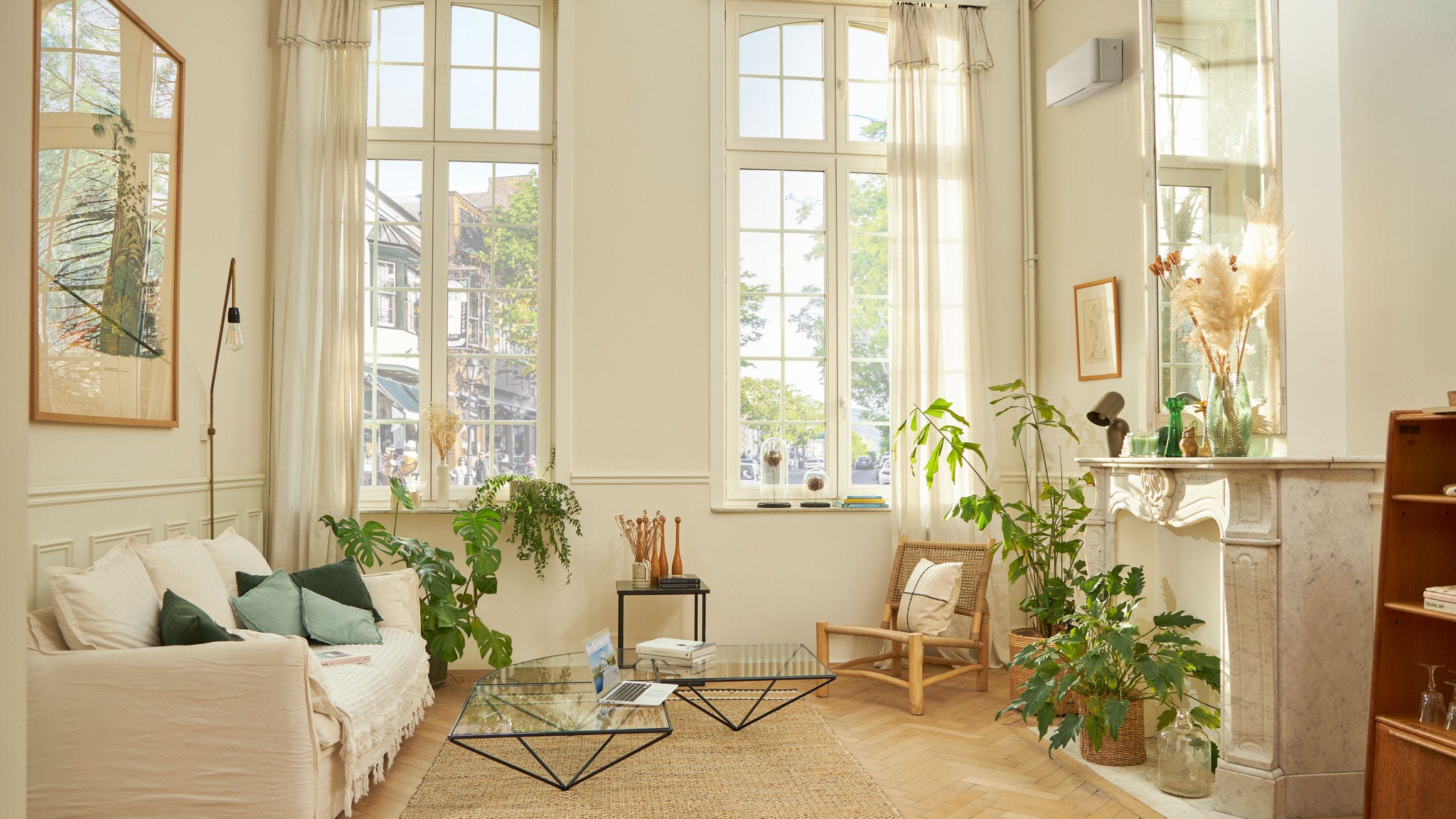 Beautifully decorated living room with a white wall-mounted climate system