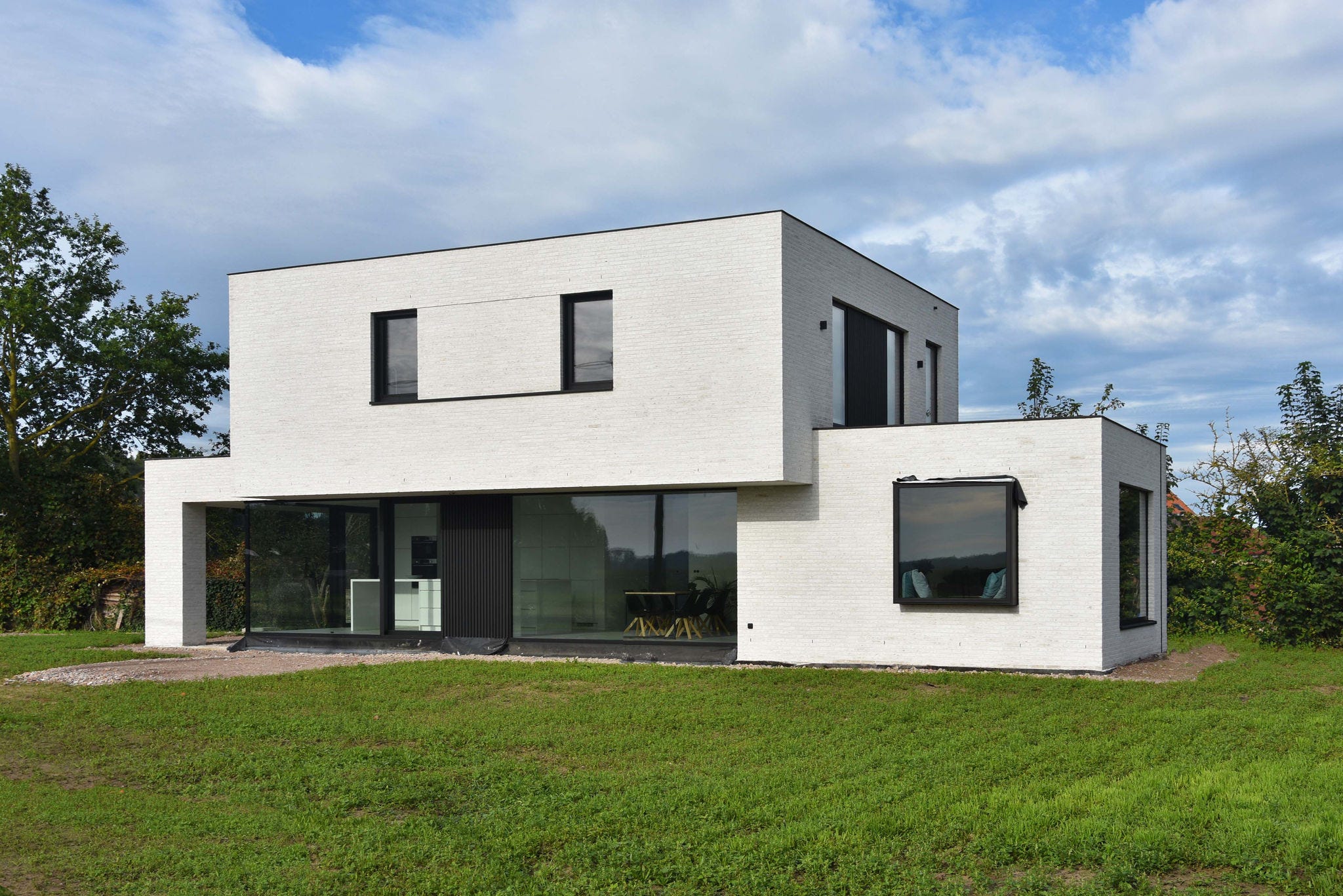 Modern energy-efficient home with a Daikin air-to-water heat pump for sustainable heating