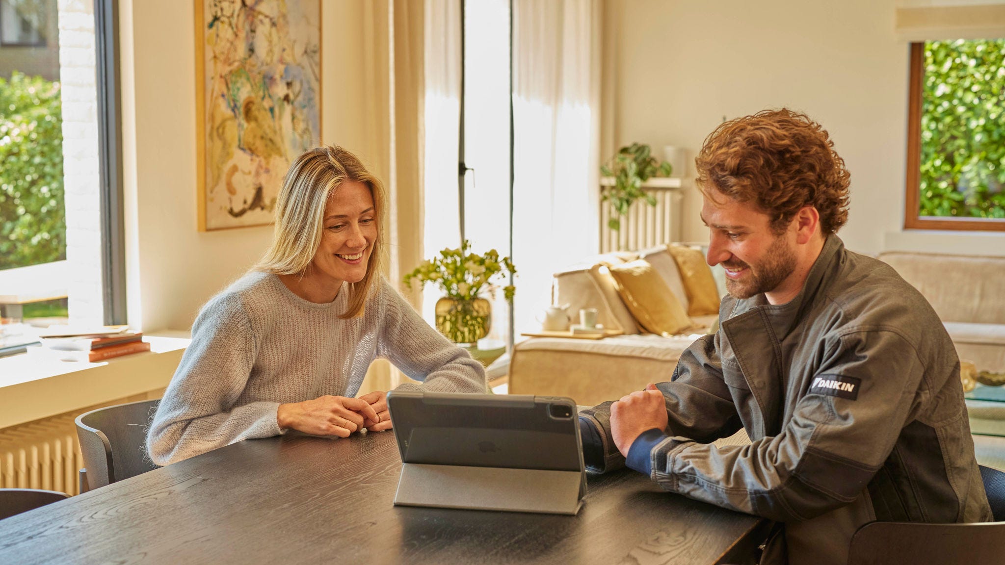 Installer talking to woman with iPad