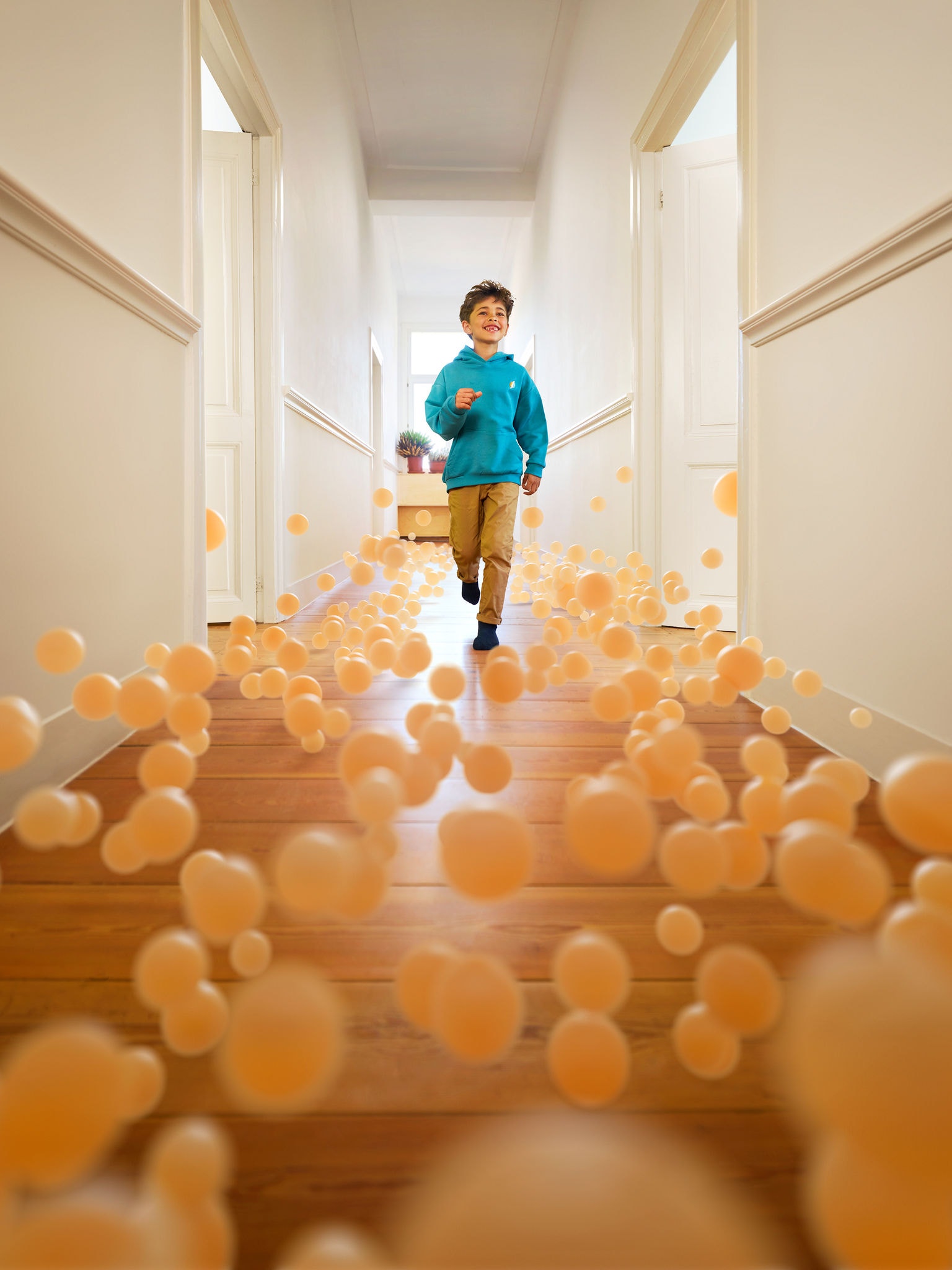 Boy running through hallway of house with perfect temperature