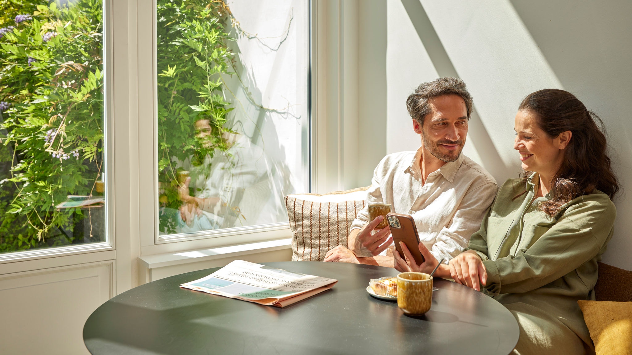 Couple enjoying sustainable heating in their home with exceptional efficiency and performance