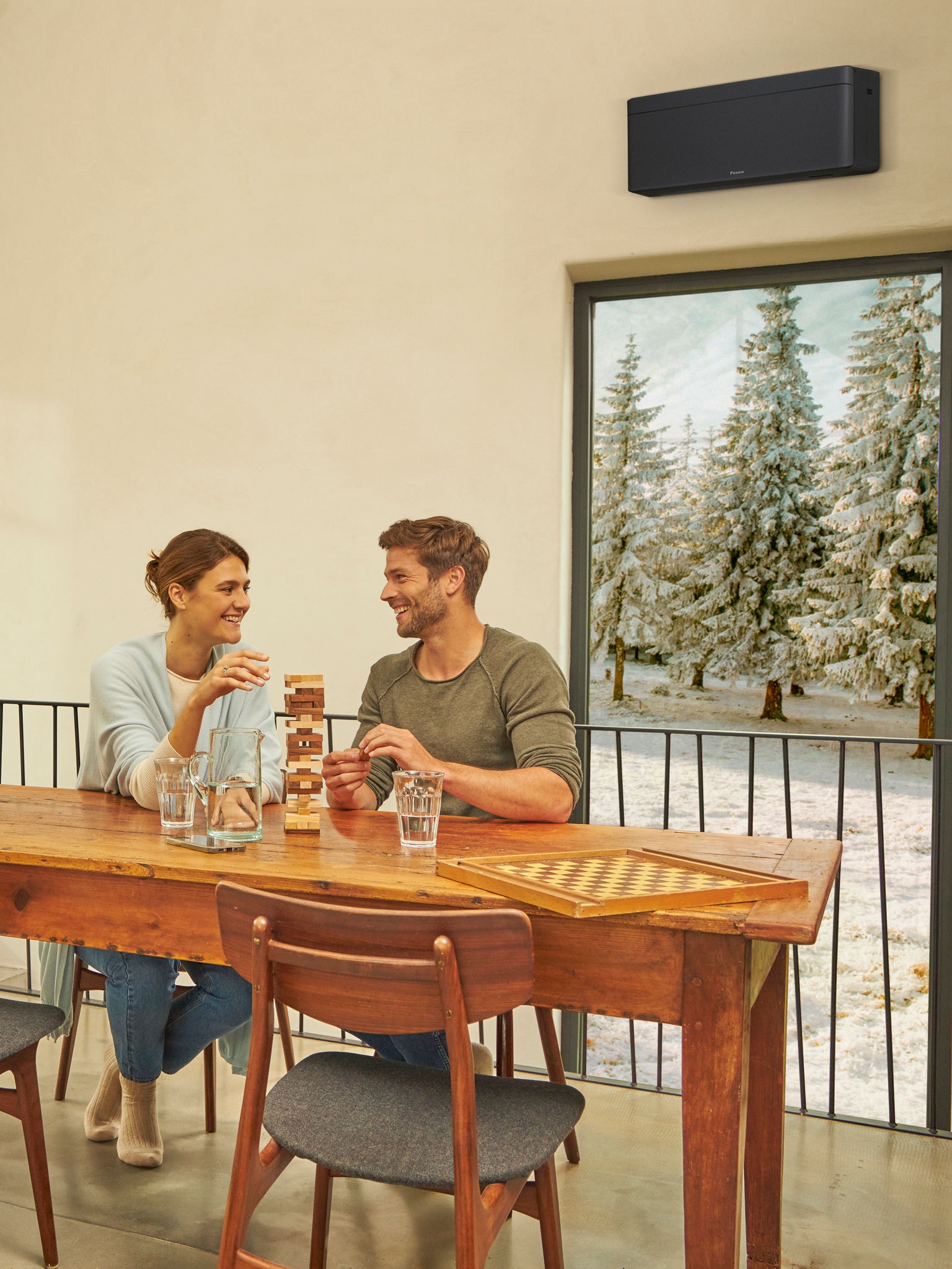 Couple playing a game in their cosy home