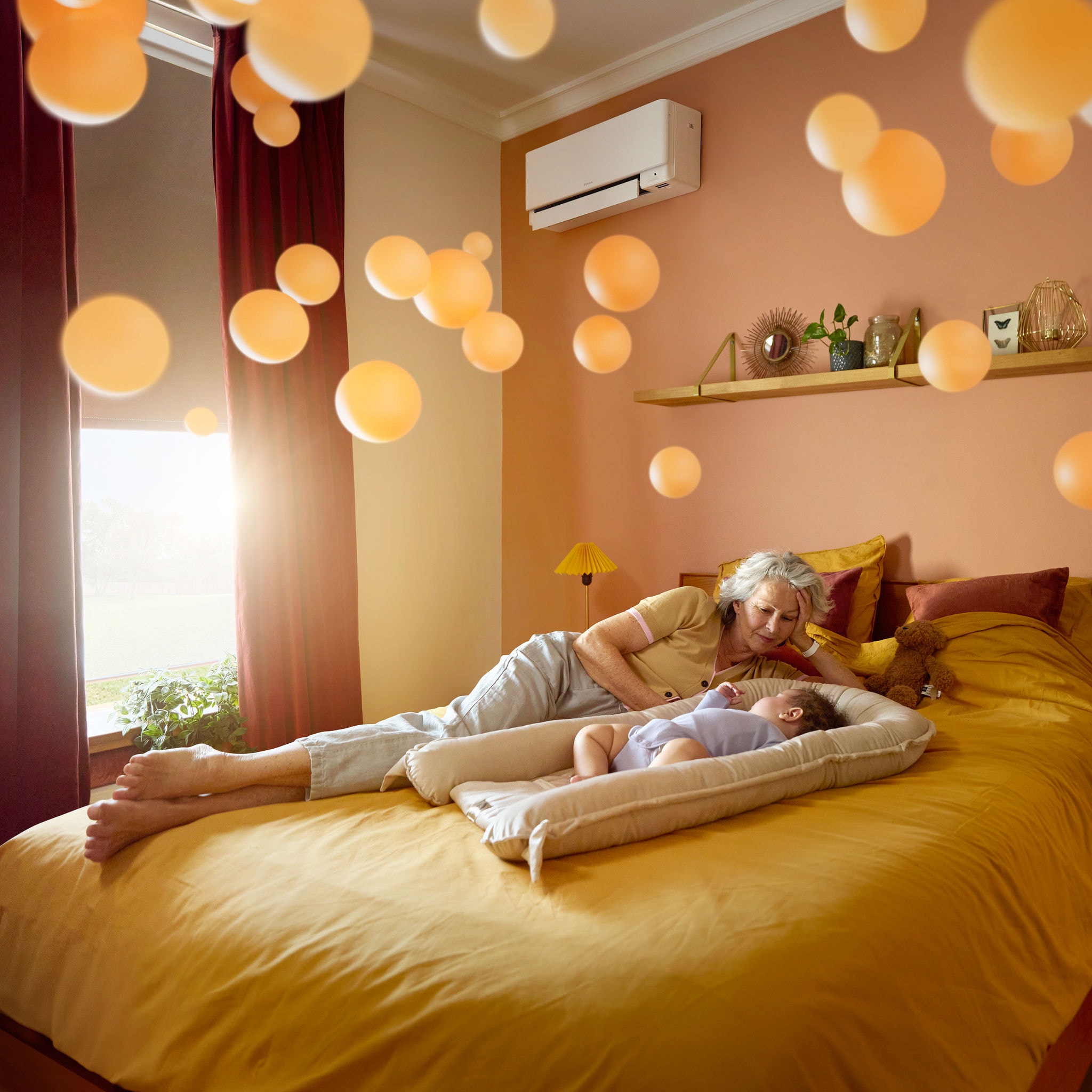 Grandmother lying beside a peacefully sleeping baby in a quiet, comfortably heated room, thanks to a whisper-quiet air-to-air heat pump