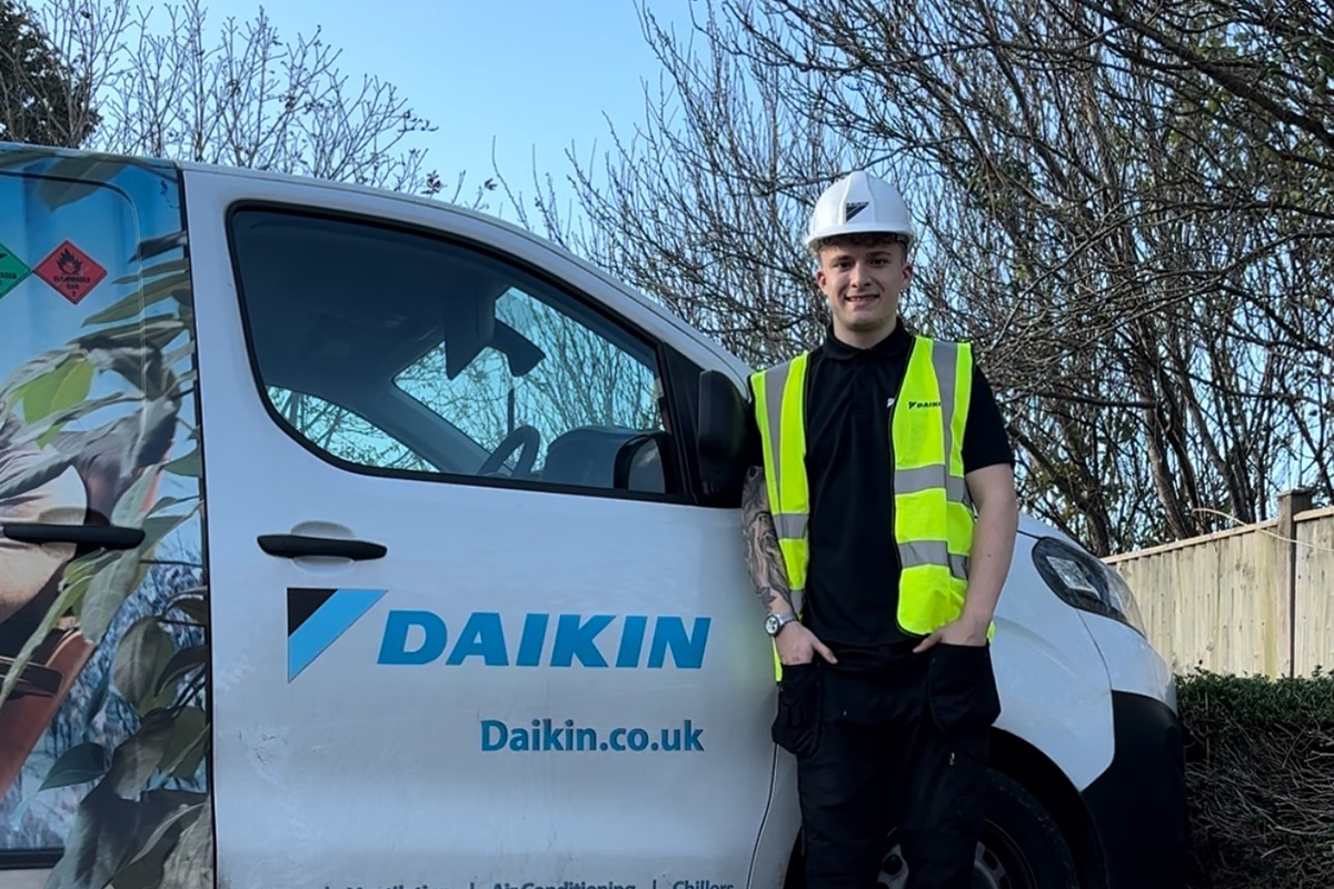 Ethan Aubert in front of Daikin van