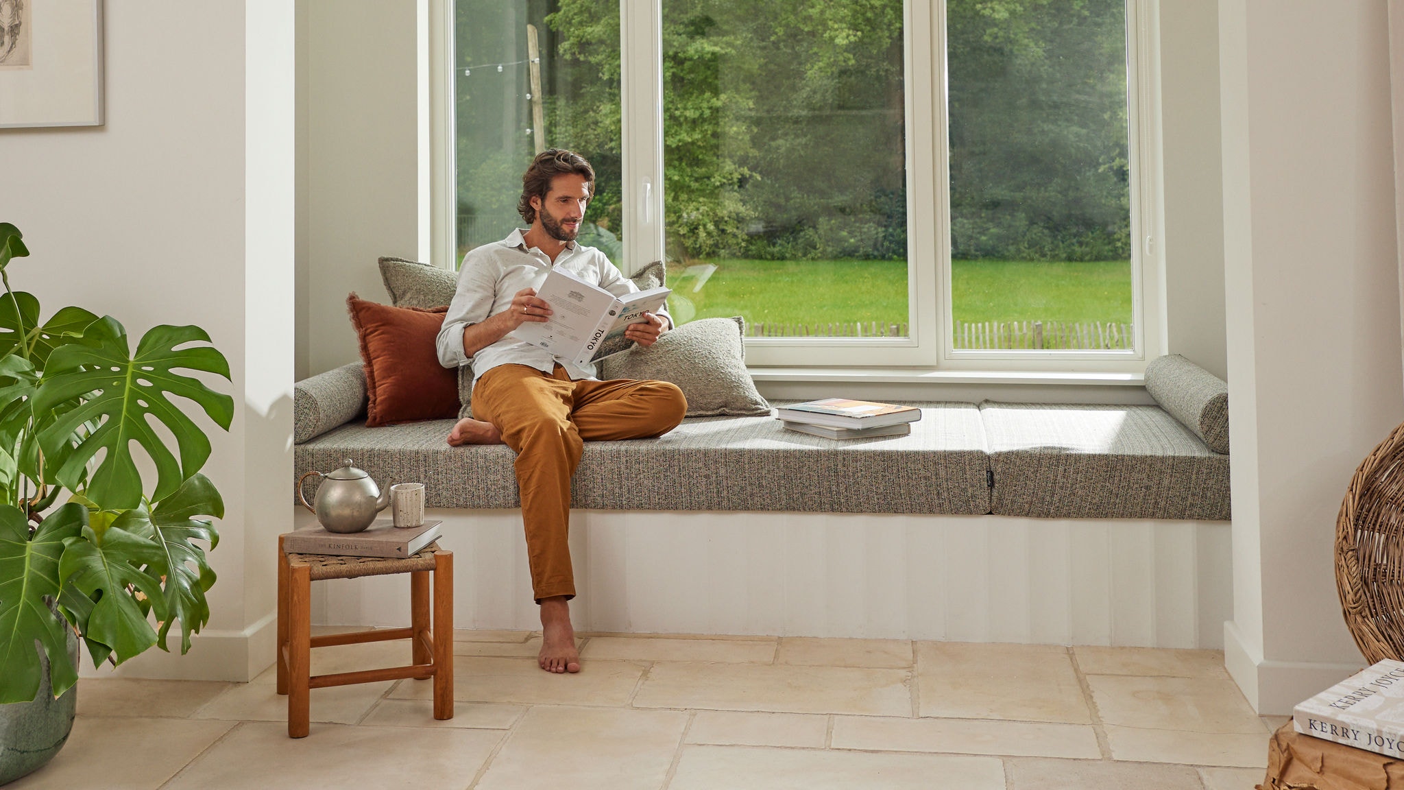 Man reading in well-ventilated home