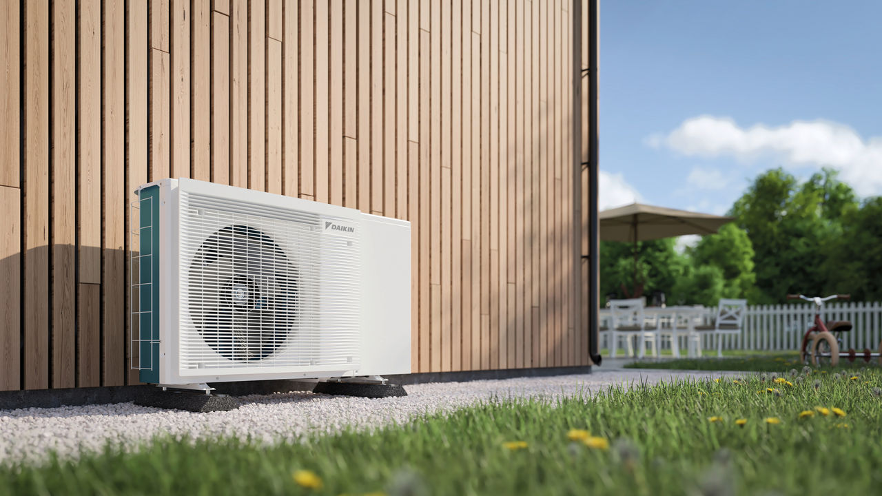 Heat pump outdoor unit installed in a garden, showcasing how heat pumps increase the value of your property