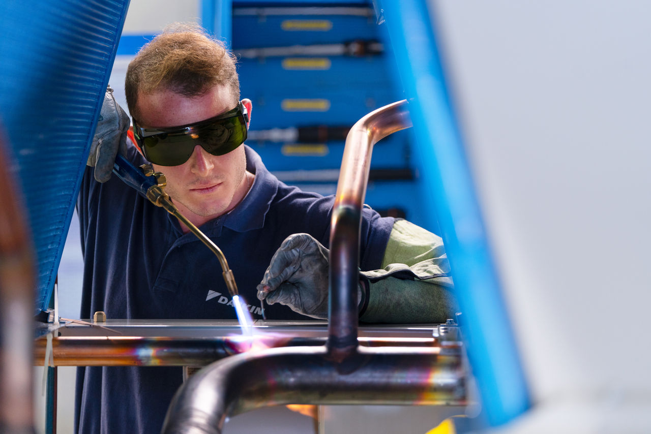 Man working on HVAC upgrades